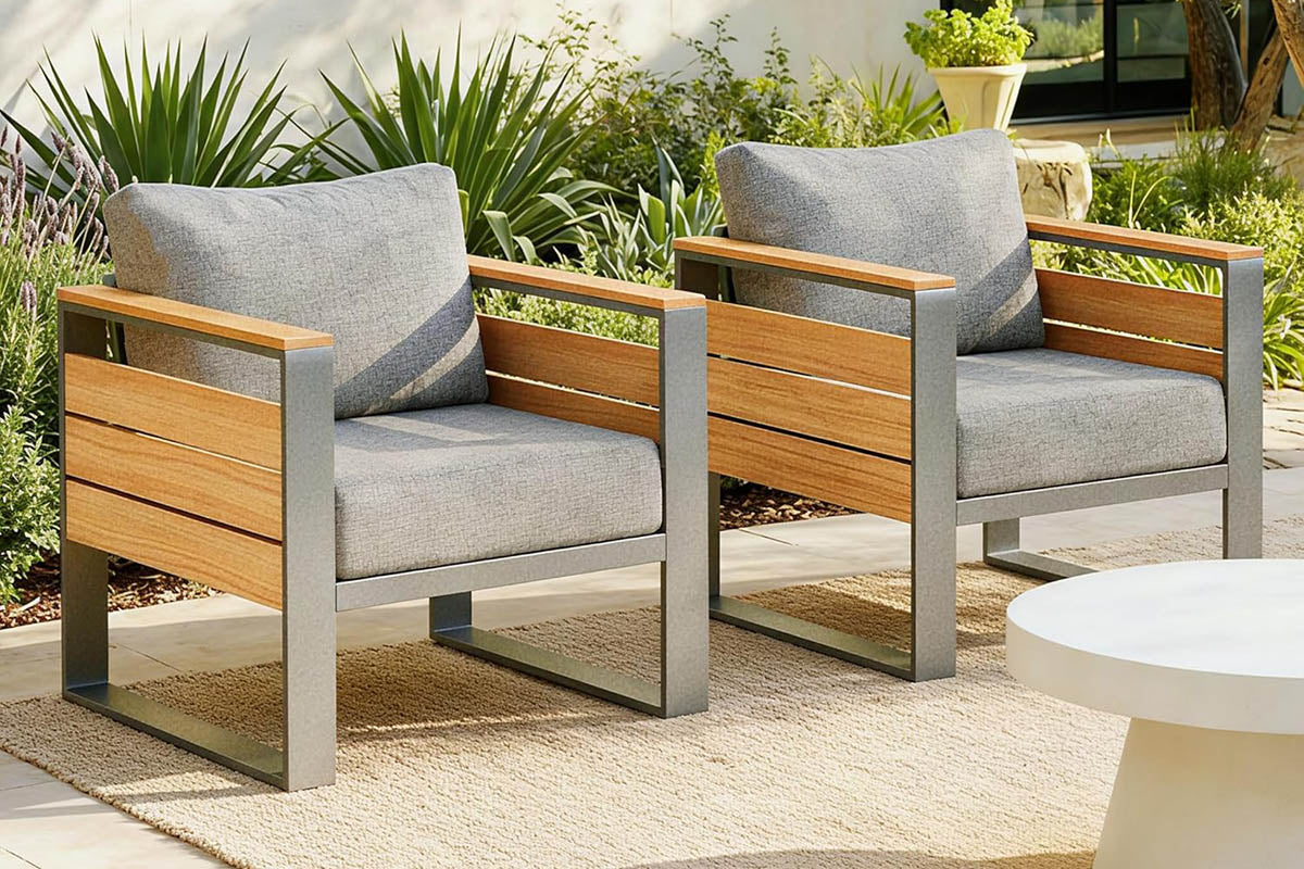 Two wooden finish outdoor chairs with gray cushions on a patio.#color_gray
