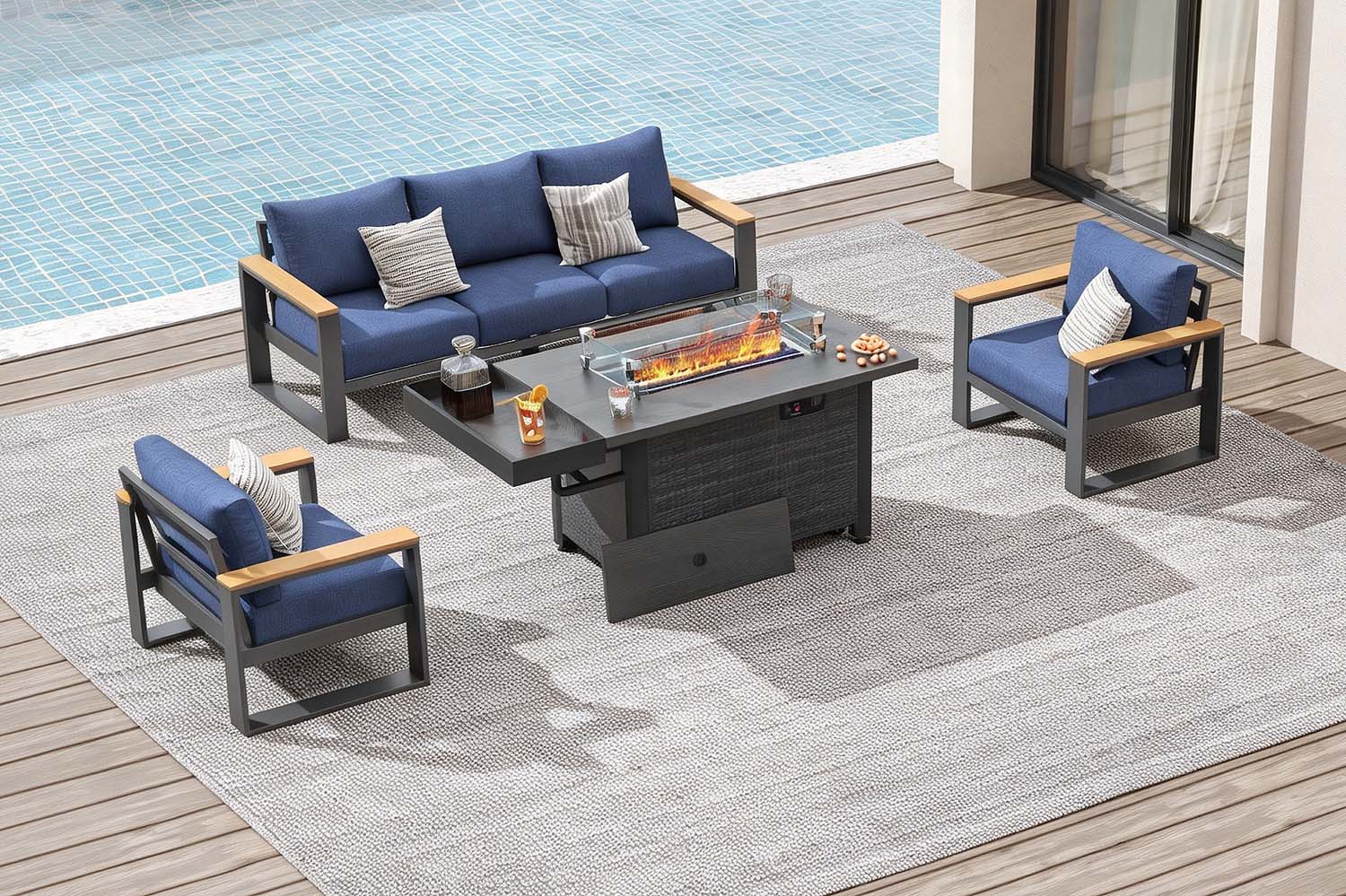 Outdoor patio set with blue cushions by a poolside