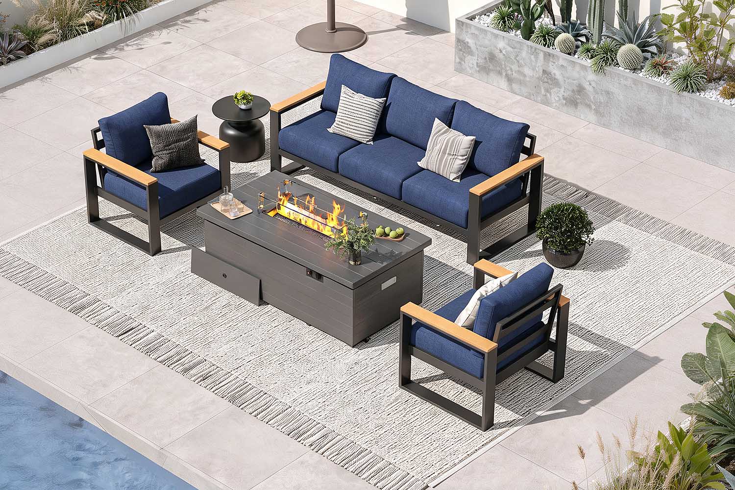 Outdoor patio set with blue cushions and a fire pit table on a patio.#color_deep navy
