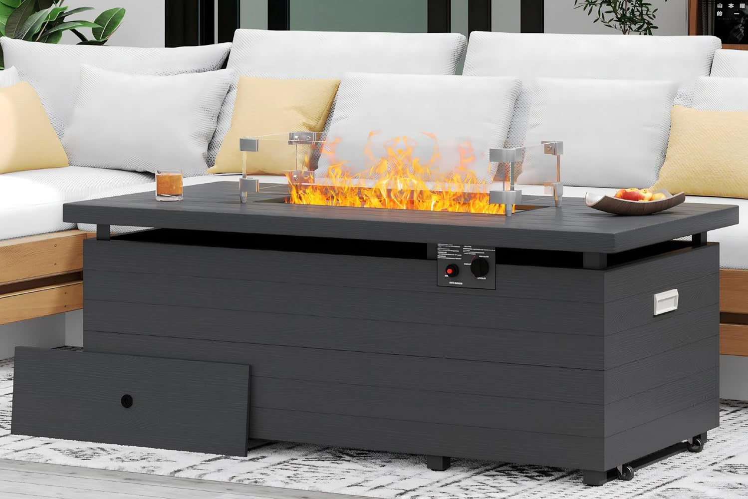 Outdoor fire pit table with flames on a patio.#color_gray