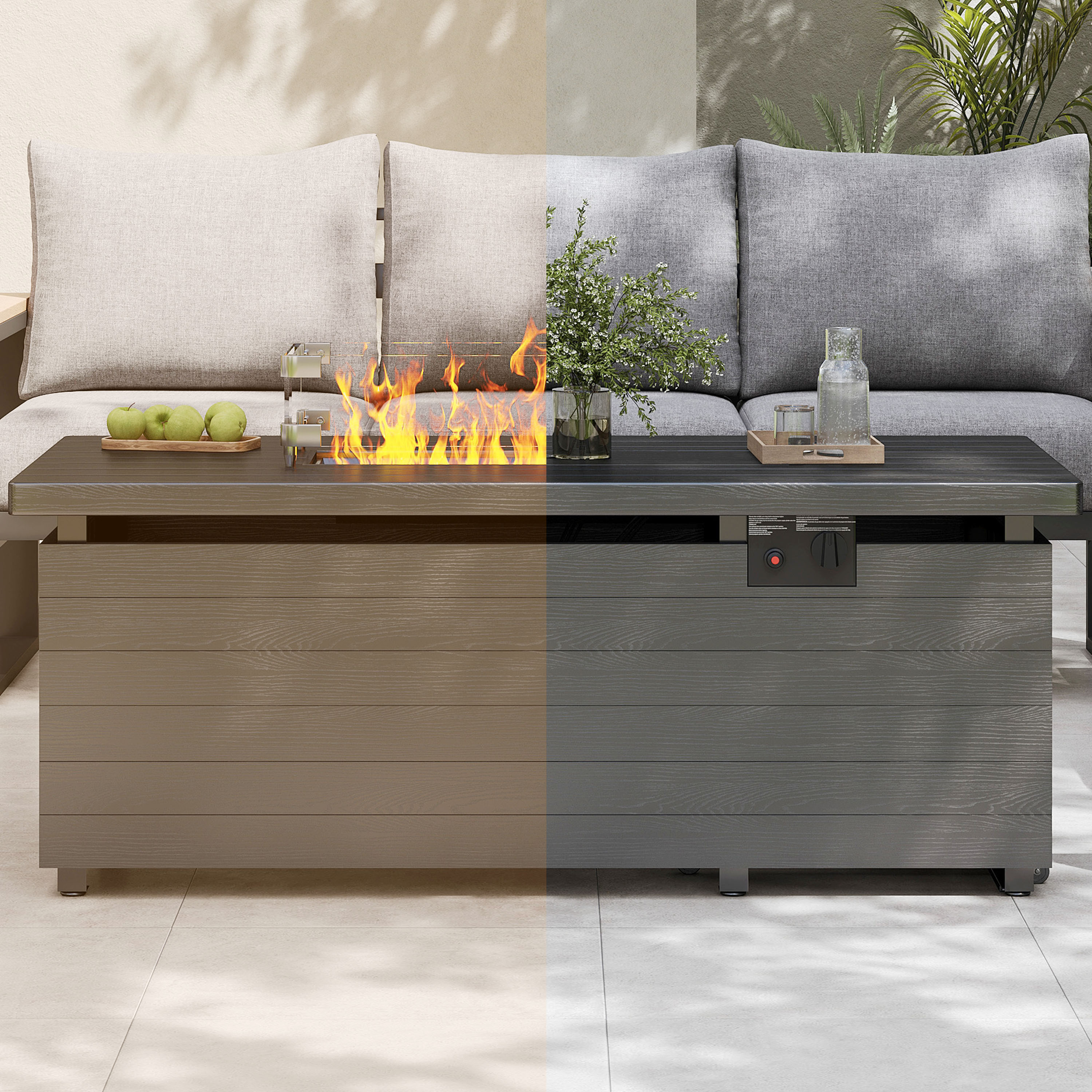 Outdoor fire pit table with flames, plants, and glasses on a patio.