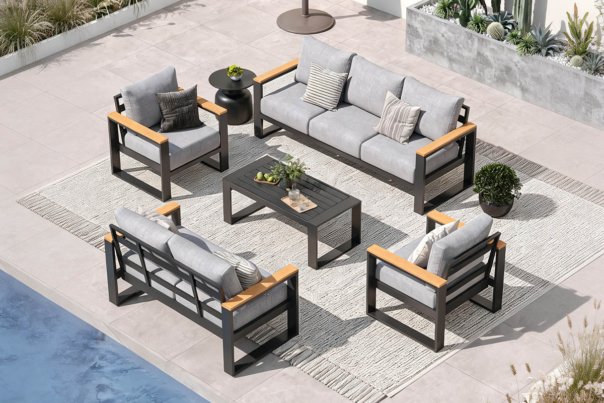 Outdoor patio furniture set with gray cushions and wooden accents on a patio.#color_light gray
