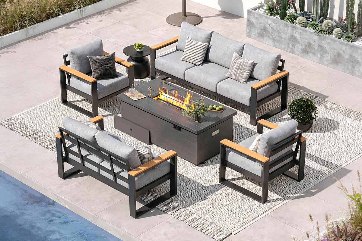 Outdoor patio furniture set with fire pit table on a concrete patio.#color_light gray