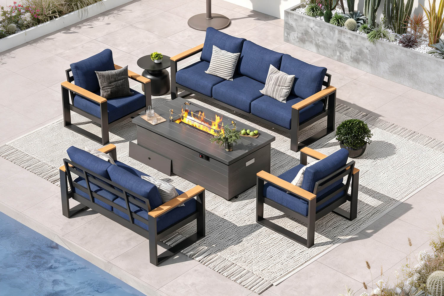 Outdoor patio furniture set with blue cushions and a fire pit table on a patio.#color_deep navy