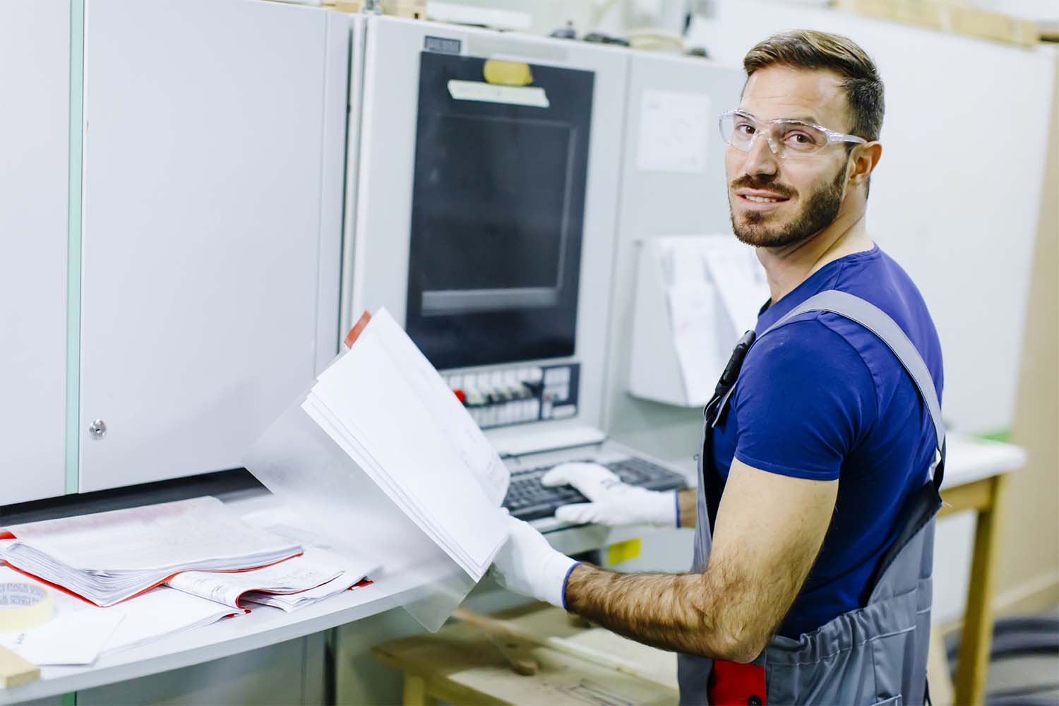 Handsome young man working in the furniture factory