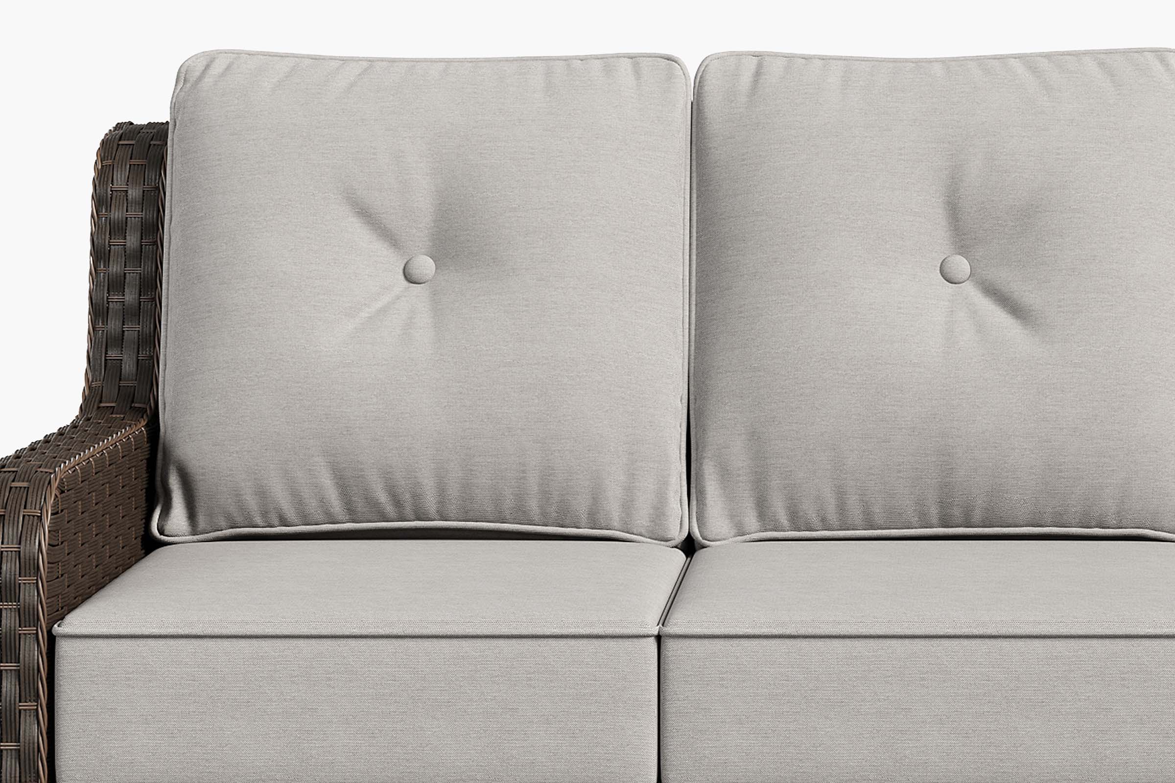 Gray cushioned outdoor sofa with wicker frame on a white background.#color_gray