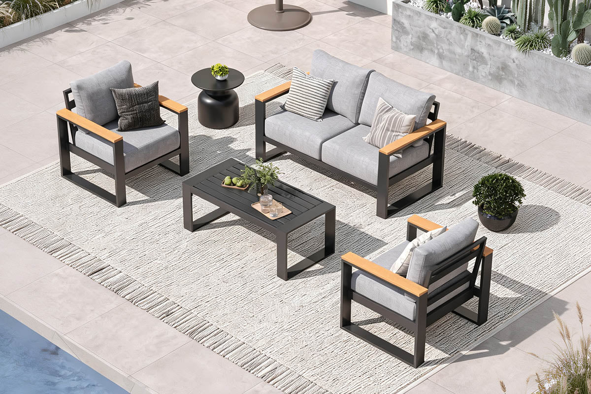 Outdoor patio furniture set with gray cushions and wooden accents on a concrete patio.#color_light gray