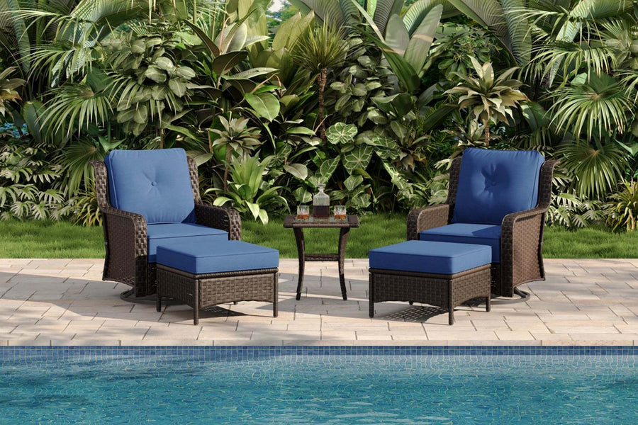 Outdoor patio set with blue cushions by a pool