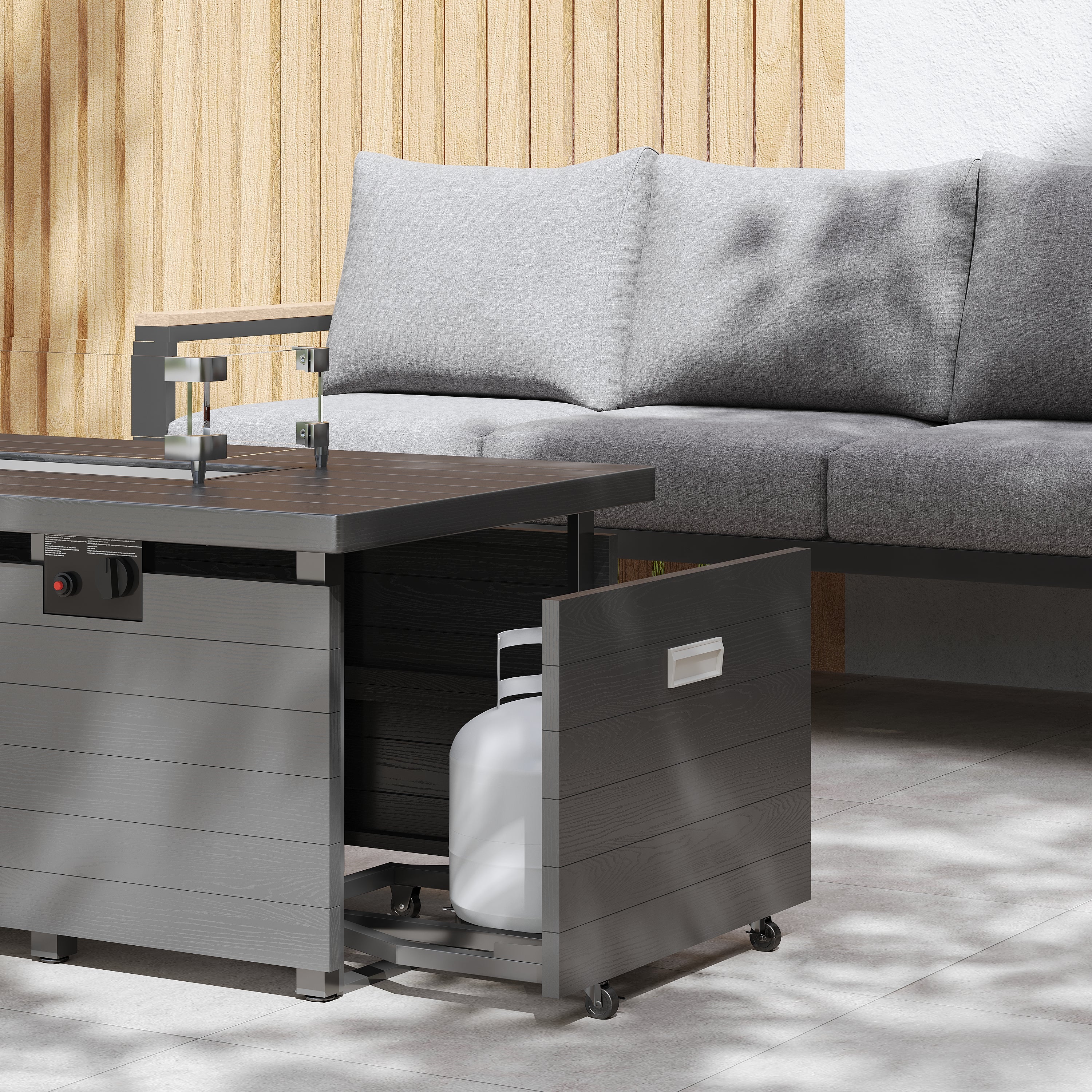 Outdoor furniture set with a gray sectional sofa and a fire pit table with storage drawers.
