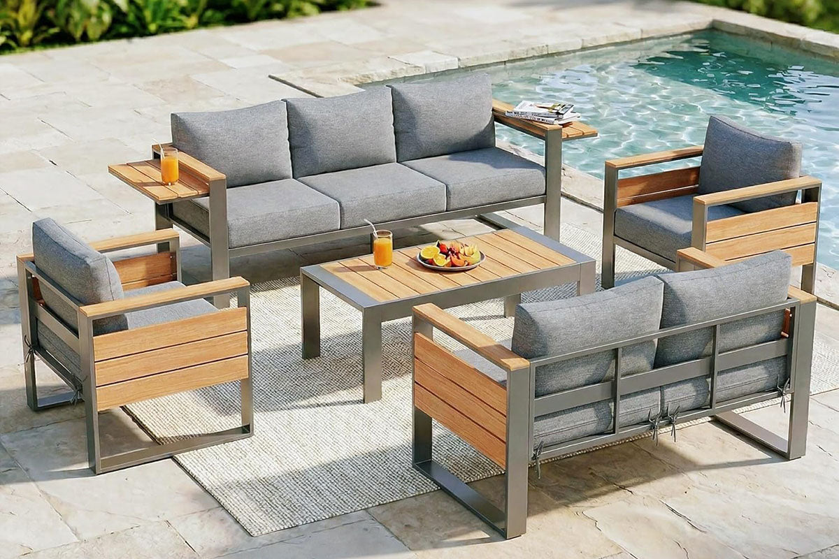 7-Seats Aluminum Outdoor Gray Conversation Set with Coffee Table by the poolside.#color_gray