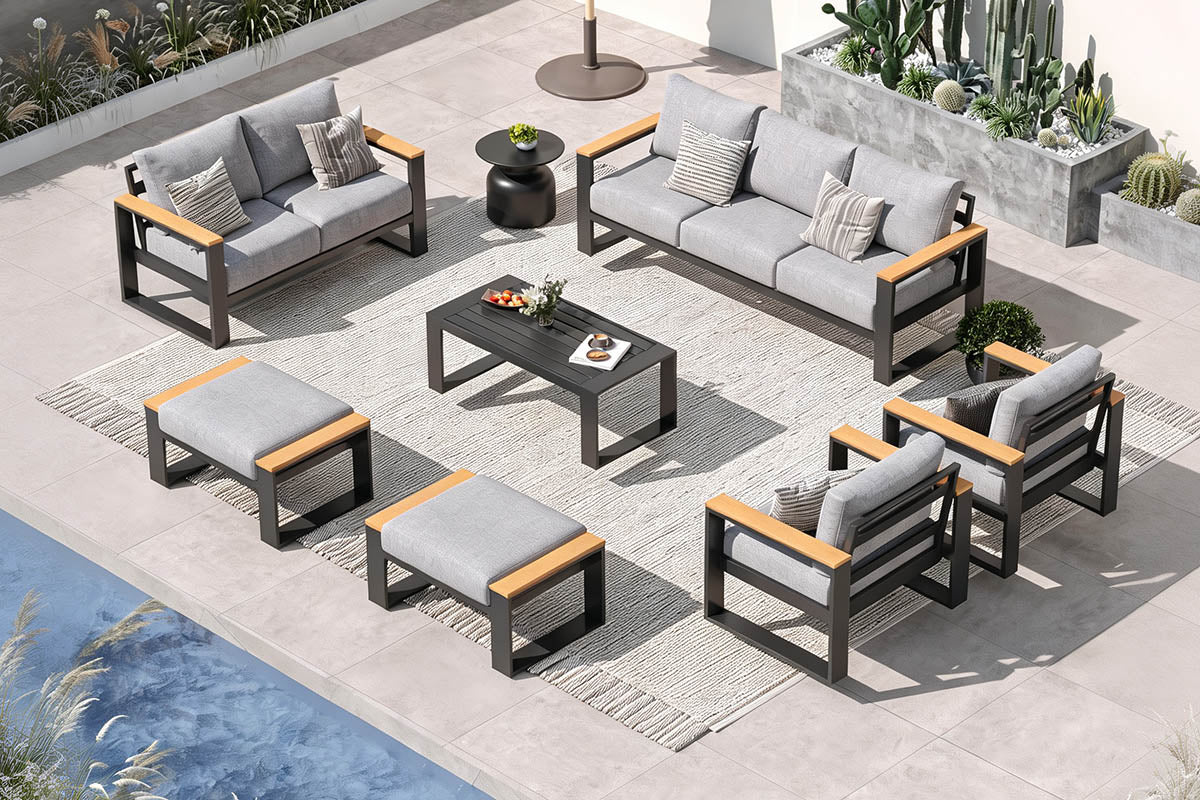 Outdoor patio furniture set with gray cushions and wooden accents on a patio.#color_light gray