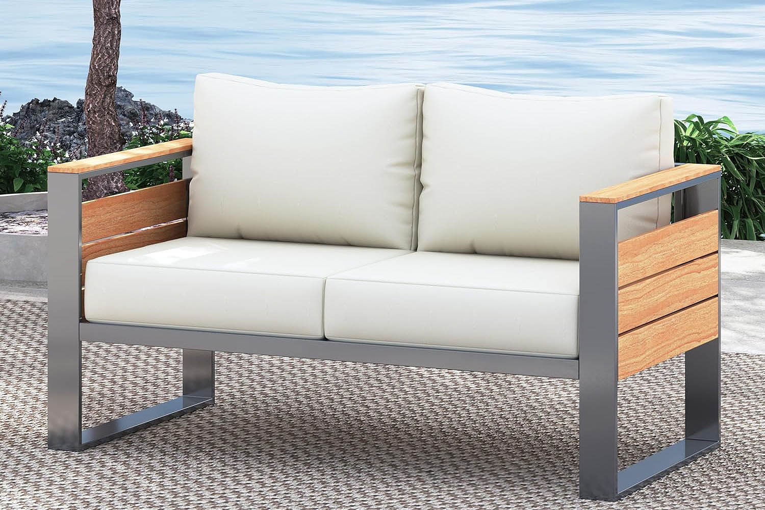 Outdoor sofa with wooden grain frame and white cushions on a patio with ocean view.#color_beige