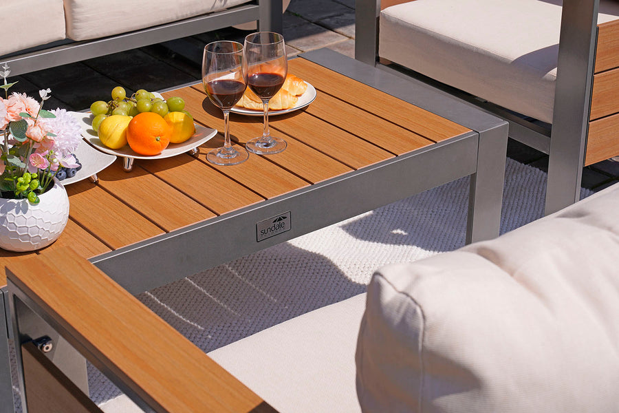 Outdoor table with fruit and wine glasses on a patio setting